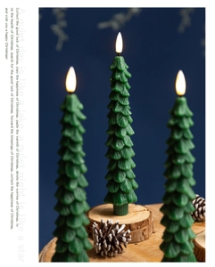 Christmas tree shaped electronic candle with warm yellow flame on wood and pine cone base