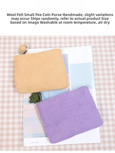 Detailed view of handmade square wool felt wallets with zippers and leaf charms