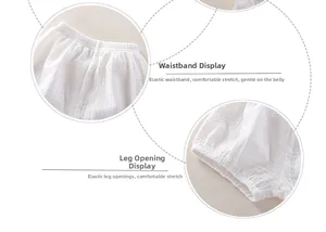 Detail of white cotton gauze baby shorts with elastic waist and soft leg cuffs