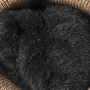 Winter thermal knit beanie featuring thick brown ribbing and soft black fleece lining