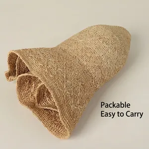 Foldable handmade raffia sun hat for women featuring a wide brim and flexible straw design