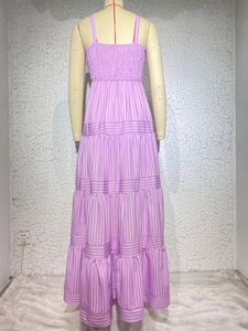 Detailed back view of purple striped tiered maxi dress with smocked bodice and straps