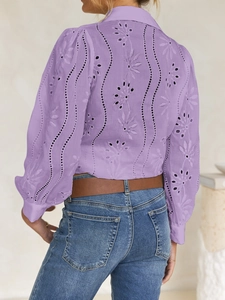 Detail view of purple hollow-out embroidery on the back of a casual women shirt
