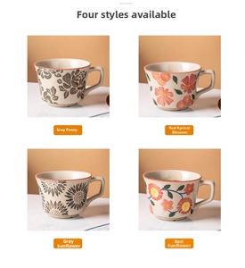 Detail view of four vintage ceramic mugs with hand-painted floral designs and round handles