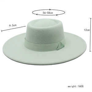 Detail showing mint green boater hat with dimensions: 9.5cm brim and 56-58cm circumference