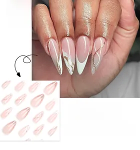 Detail of pink and white marble French stiletto press-on nails with golden glitter edges
