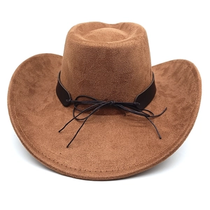 Detailed close-up of brown felt cowboy hat with leather band and decorative black stitching
