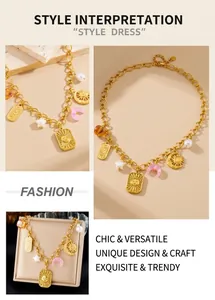 Detailed macro view of gold-plated square sun relief pendant with pearl and moon charms