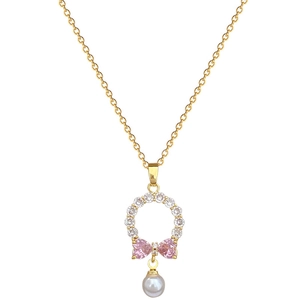Gold necklace with pink bow pendant, white cubic zirconia, and elegant pearl detail