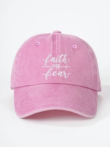Close-up of Faith Over Fear embroidery on a pink washed cotton baseball cap