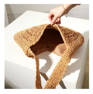 Detailed view of the fabric lining and spacious interior of the woven straw beach tote