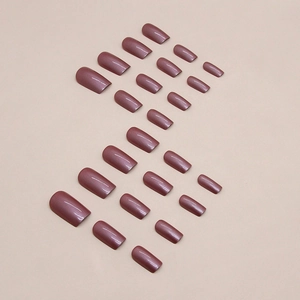 Glossy pearlescent purple square fake nails 24pcs set in a flat lay display