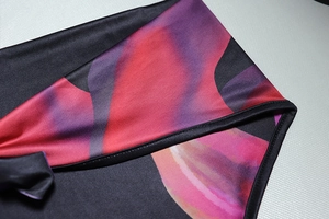Detail shot of black floral digital print fabric with durable reinforced stitching