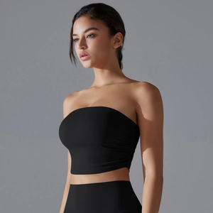 Close-up of black strapless yoga top featuring ruched side details and elastic fabric