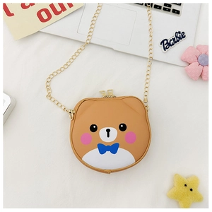 Close-up of a brown cartoon bear crossbody bag with gold chain and dual zipper details