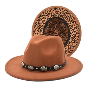 Detail view of brown wool fedora with leopard print lining and metal buckle belt strap