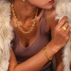 Detail shot of 18K gold plated twisted rope chain necklace and matching jewelry set