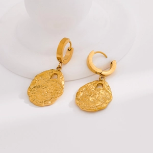 Modern gold hoop earrings featuring irregular lava texture and hollow molten design charms