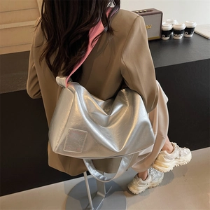 Silver large capacity Boston tote bag with pink contrast strap and metallic finish