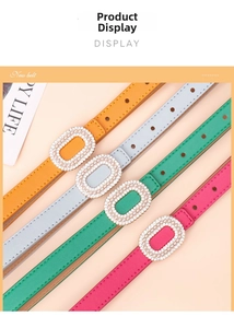 Detail of colorful narrow belts with pearl-embellished oval buckles for women