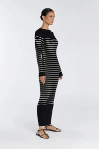 Side view of a slim-fit striped long-sleeved knitted maxi dress in black and white