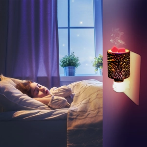Plug-in wax warmer with fireworks pattern used in a child's bedroom for a cozy atmosphere