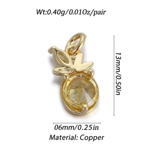 Detail shot of 14k gold-plated copper pineapple charms with yellow cubic zirconia stones