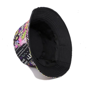 Reversible 90s party graffiti canvas bucket hat with retro cassette pattern and black side