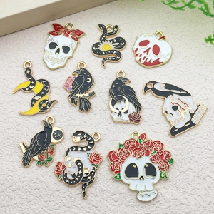 Detailed set of 10 enamel charms featuring skulls, snakes, and crows for DIY jewelry making