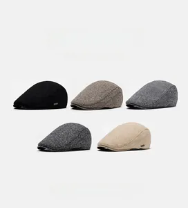 Detail showing various colors of British style wool blend newsboy caps for winter