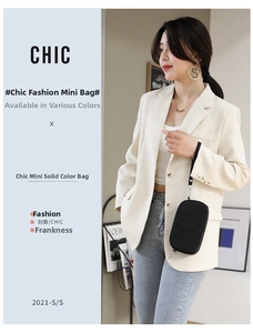 Wristlet clutch bag in black nylon featuring a circular logo and convenient hand strap