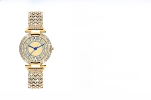 Detail view of gold quartz watch with rhinestones on bezel and blue roman numeral hands