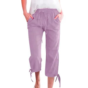 Detail of lavender cotton linen pants showing drawstring waist and side pocket texture