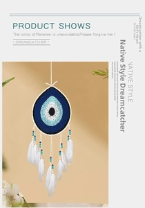 Detail of bohemian dream catcher with evil eye crochet and soft white feathers