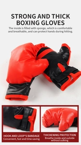 Detail of red and black PU leather boxing gloves with adjustable hook and loop wrist straps