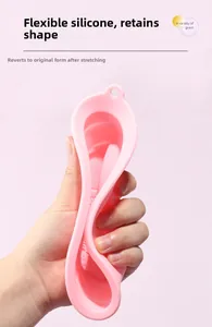 Flexible pink silicone makeup brush cleaner bowl showing soft texture and grainy pattern
