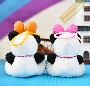 Back view of two cute panda plush keychains featuring colorful bows and purple chains