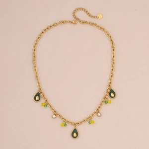 Macro shot of gold stainless steel necklace featuring avocado pendants and colored crystals