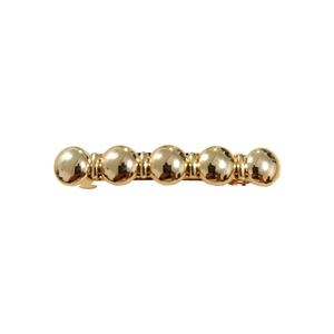 Elegant gold hair clip featuring five polished metallic spheres in a linear design