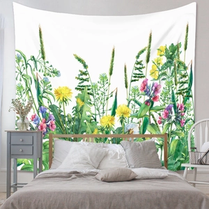 Detail of bohemian tapestry featuring watercolor wildflowers used as bedroom wall decor