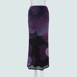 Close-up of elegant purple mesh skirt featuring deep floral print and layered drape
