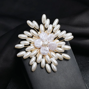 Handcrafted pearl and gold wire flower brooch for women with elegant white crystal details