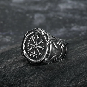 Antique silver Viking Vegvisir compass ring in stainless steel on black rock background
