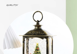 Close-up of vintage bronze Christmas lantern with miniature decorated tree and berries