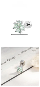 Detail shot of a 0.72cm clover stud earring with light green heart-shaped zircons