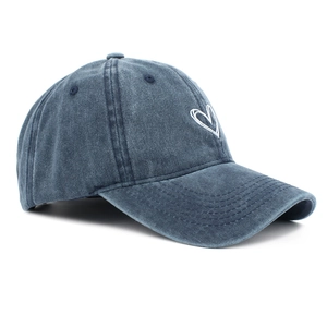 Detailed embroidery of white heart on dark blue washed denim vintage baseball cap