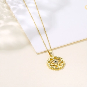 Retro zircon Turkish evil eye necklace in gold finish on a minimalist background