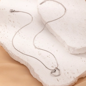 Vintage silver titanium steel necklace with a hollow heart pendant and elegant snake chain