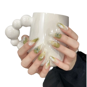 Handmade gradient green press-on nails with 3D butterfly and gold glitter accents