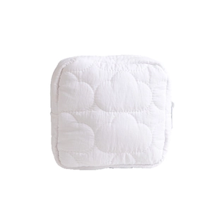 Portable cream cloud quilted storage bag with zipper for travel and makeup storage